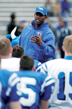 Turner Gill gives instructions